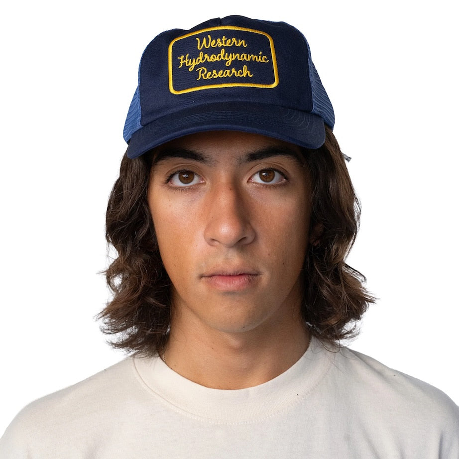 [WESTERN HYDRODYNAMIC RESEARCH] Script Trucker Hat (Navy / Gold)